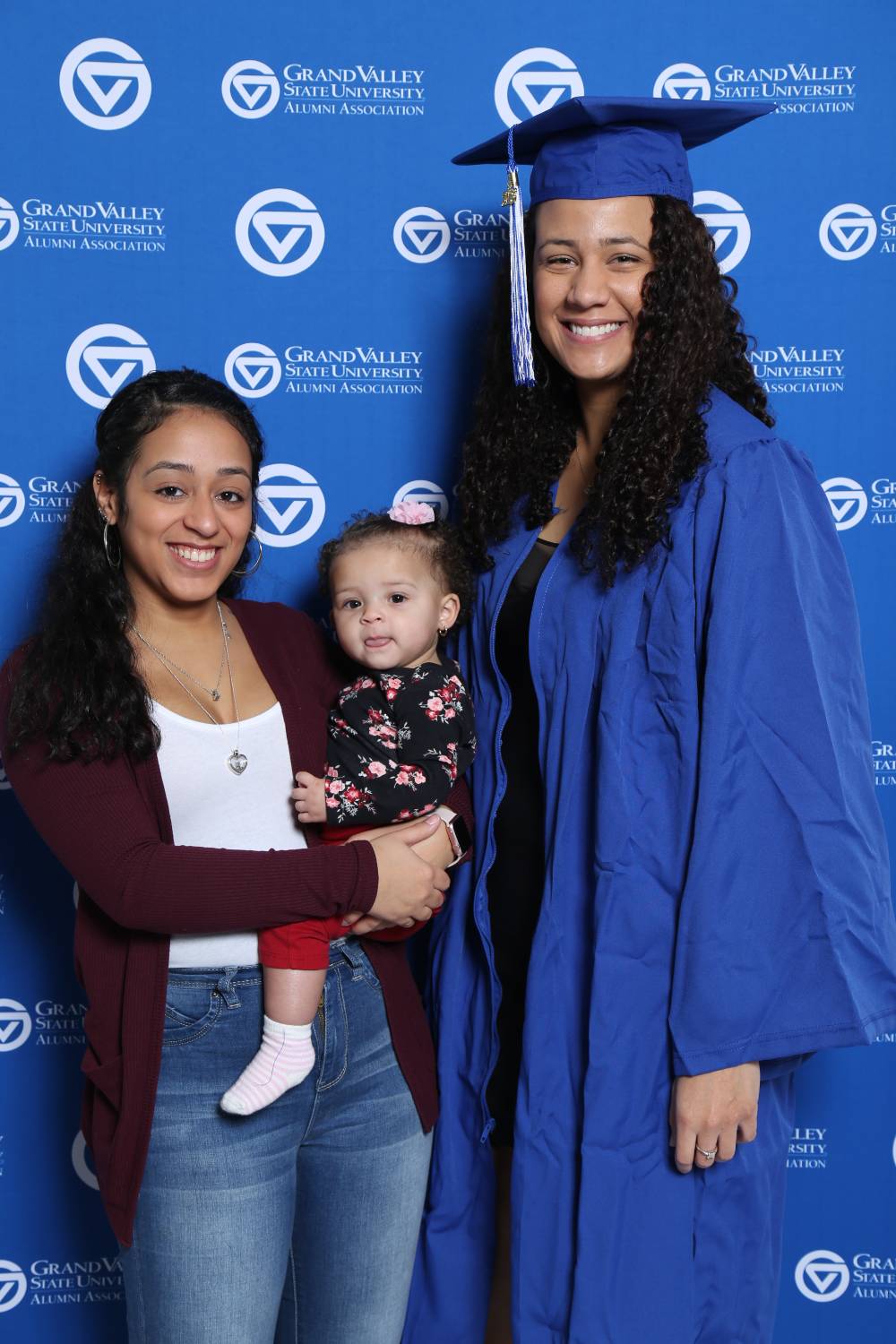 A future alumna poses with family at GradFest